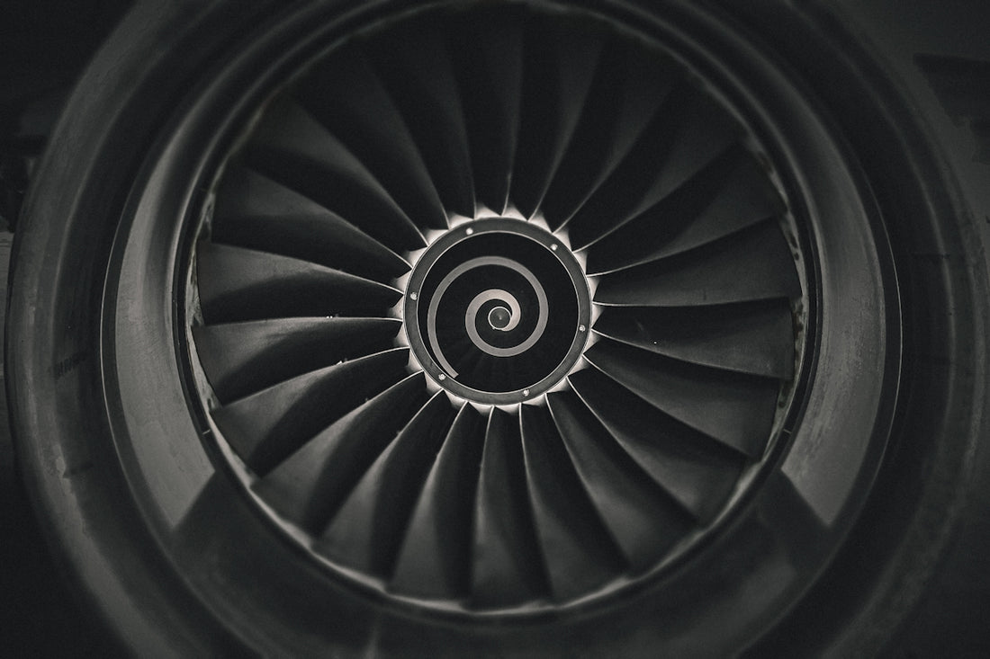a black and white photo of a jet engine