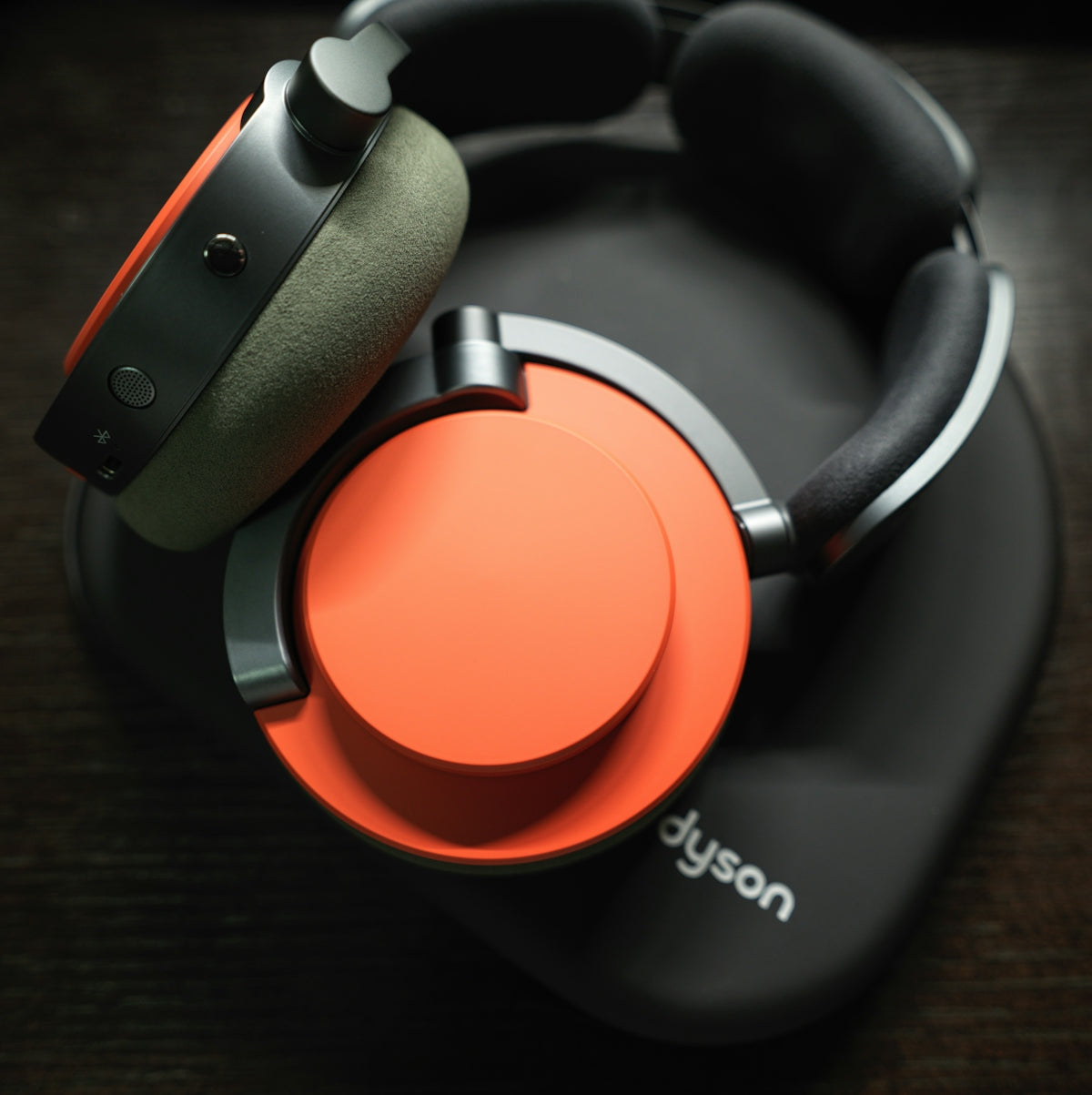 A pair of headphones sitting on top of a wooden table